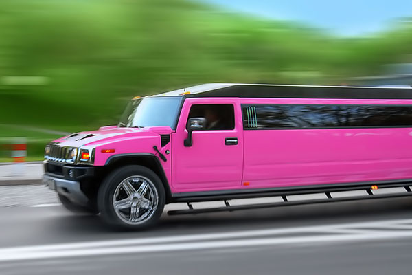 Bachelorette or bachelor party with pink limousine
